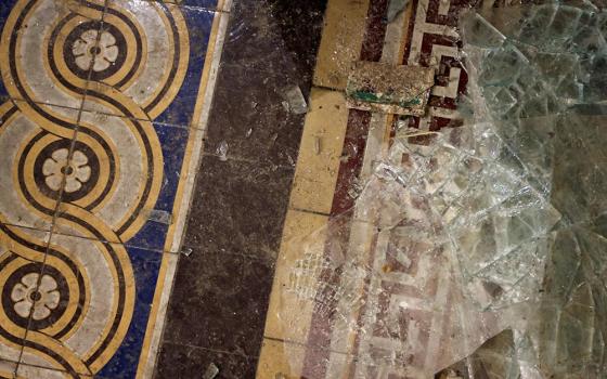 Broken glass is seen on the floor of the U.S. Capitol in Washington Jan. 7, 2021, after supporters of then-President Donald Trump occupied the building the previous day. (CNS/Reuters/Jonathan Ernst)