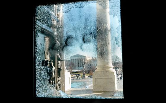 The U.S. Supreme Court is seen through a smashed glass door at the U.S. Capitol in Washington Jan. 7, one day after supporters of President Donald Trump stormed Capitol Hill. (CNS/Reuters/Erin Scott)