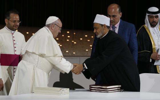 Pope Francis shakes hands with Sheik Ahmad el-Tayeb, grand imam of Egypt's al-Azhar mosque and university, during a document signing at an interreligious meeting at the Founder's Memorial in Abu Dhabi, United Arab Emirates, in this 2019 file photo (CNS)