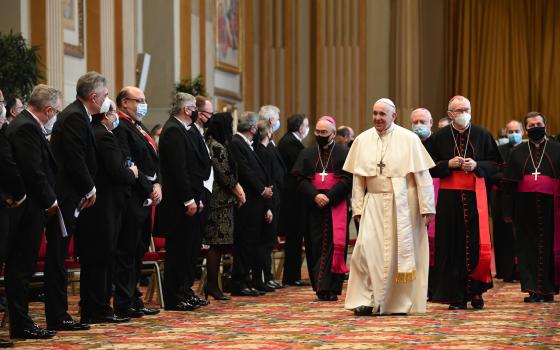 Pope Francis walks near diplomats accredited to the Holy See during an audience in the Hall of Blessings at the Vatican Feb. 8, 2021. (CNS/Vatican Media)