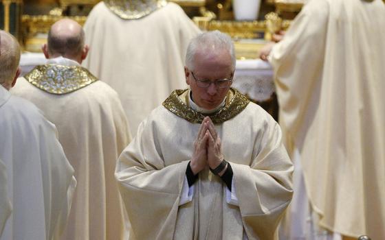 Bishop John Brungardt of Dodge City, Kansas, returns to his seat after receiving Communion during a Mass with U.S. bishops from Iowa, Kansas, Missouri and Nebraska at the Basilica of St. Mary Major in Rome Jan. 14, 2020. (CNS/Paul Haring)