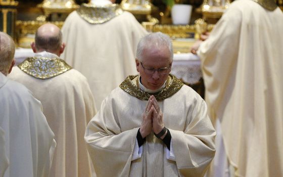 Bishop John Brungardt of Dodge City, Kansas, returns to his seat after receiving Communion during a Mass with U.S. bishops from Iowa, Kansas, Missouri and Nebraska at the Basilica of St. Mary Major in Rome Jan. 14, 2020. (CNS/Paul Haring)