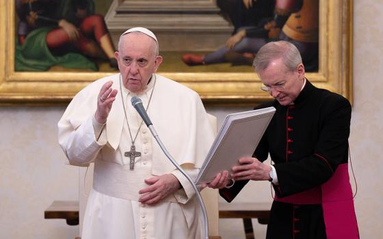 Pope Francis delivers his blessing during his general audience in the library of the Apostolic Palace Feb. 10 at the Vatican. The pope spoke about the importance of daily prayer. (CNS/Vatican Media)