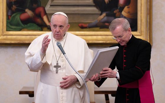 Pope Francis delivers his blessing during his general audience in the library of the Apostolic Palace Feb. 10 at the Vatican. The pope spoke about the importance of daily prayer. (CNS/Vatican Media)