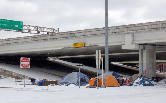 A homeless encampment is pictured under a highway overpass Feb. 16, 2020, during a winter storm in Austin, Texas. Austin planned to operate over a dozen warming shelters around the clock for the city's vulnerable population until the historic cold outbrea