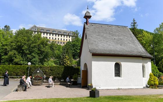 Pilgrims pray in front of the original Schonstatt Shrine in Vallendar, Germany, May 21, 2020. German Bishop Stephan Ackermann of Trier has ordered the reexamination of abuse allegations against Fr. Joseph Kentenich, founder of the Schonstatt movement, fro