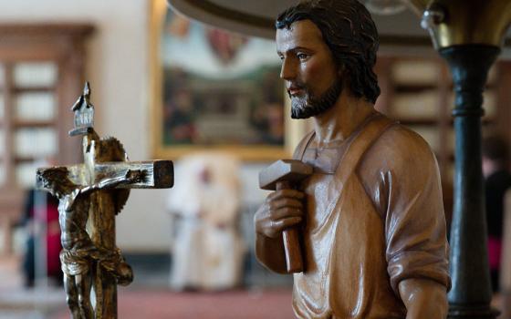 A statue of St. Joseph is seen as Pope Francis leads his general audience in the library of the Apostolic Palace at the Vatican March 24. (CNS/Vatican Media)