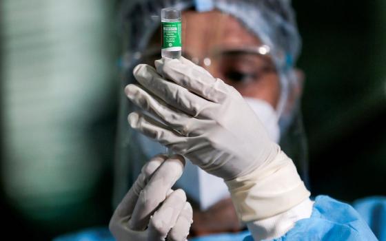 A health official draws a dose of AstraZeneca's COVID-19 vaccine at Infectious Diseases Hospital Jan. 29 in Colombo, Sri Lanka. (CNS/Dinuka Liyanawatte, Reuters)