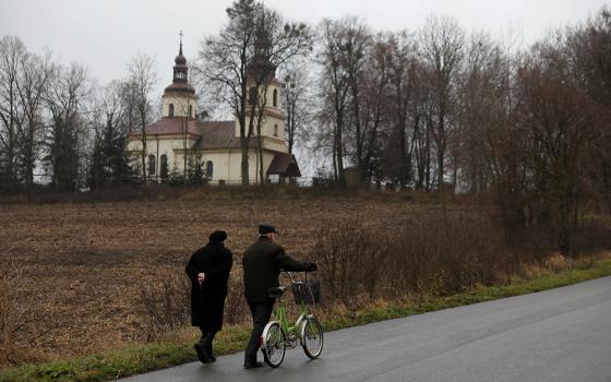 People in Kalinowka, Poland, walk to Mass in a file photo. (CNS/Reuters/Kacper Pempel)