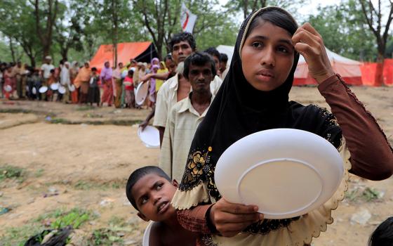 Rohingya refugees line up to get food from the Turkish Cooperation and Coordination Agency near Cox's Bazar Oct. 21, 2017, in Bangladesh. (CNS/Reuters/Zohra Bensemra)