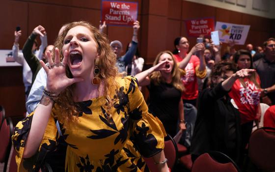 Angry parents and community members in Ashburn, Virginia, protest after the Loudoun County School Board halted its meeting because the crowd refused to quiet down June 22. Many at the meeting objected to "critical race theory" being part of the curriculum