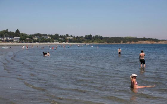 People look for ways to cool off at Willow's Beach during record-breaking temperatures in Victoria, British Columbia, June 28, 2021. (CNS photo/Chad Hipolito, Reuters)