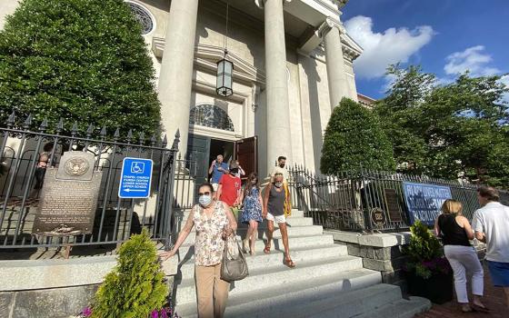 Parishioners at Washington, D.C.'s Holy Trinity Catholic Church, where President Joe Biden sometimes attends Mass, file out after Mass June 27. (CNS/Rhina Guidos)