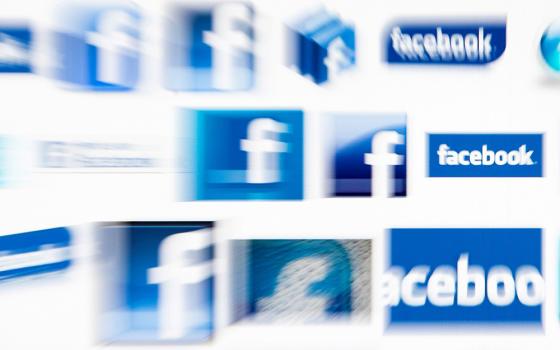 Facebook logos on a computer screen are seen in this illustration photo. (CNS/Reuters/Valentin Flauraud)