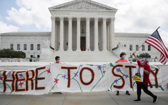 Beneficiaries of the Deferred Action for Childhood Arrivals program and their supporters celebrate outside the U.S. Supreme Court in Washington June 18, 2020, after the high court upheld DACA in a challenge brought by the Trump administration. Judge Andre