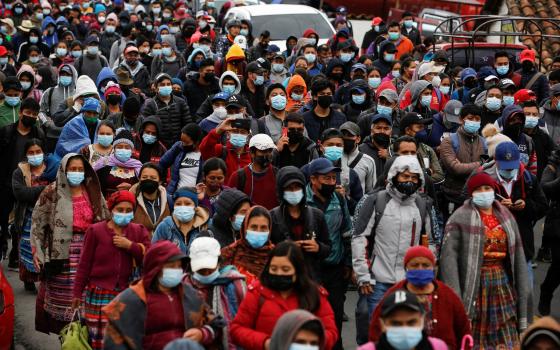 Guatemalans march during a protest demanding the resignation of President Alejandro Giammattei and Attorney General María Consuelo Porra in San Cristobal Totonicapan July 29, 2021. (CNS photo/Luis Echeverria, Reuters)