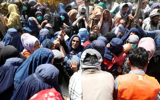 Internally displaced families from northern provinces of Afghanistan, who fled from their homes due the fighting between Taliban and Afghan security forces, take shelter at a public park in Kabul Aug. 10, 2021.