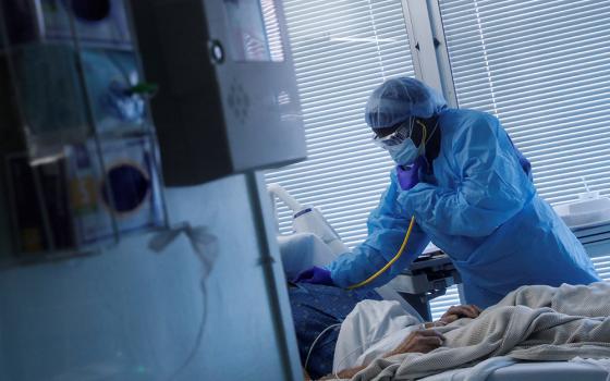 A registered nurse in Little Rock, Arkansas, checks on a COVID-19 patient Aug. 16, 2021, at the University of Arkansas for Medical Sciences. (CNS/Reuters/Shannon Stapleton)