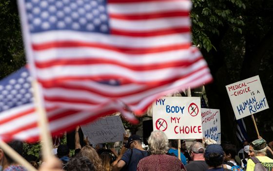 People are seen outside New York City Hall in Manhattan during a protest against mandating COVID-19 vaccines Aug. 16. (CNS/Reuters/Jeenah Moon)