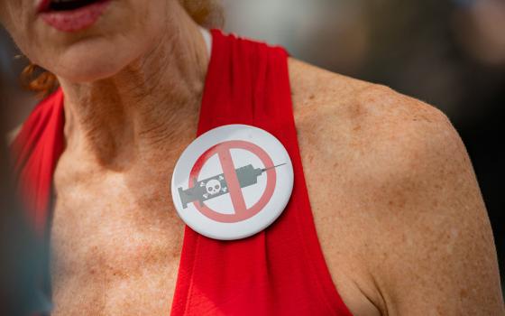 A woman outside New York City Hall in Manhattan is seen during a protest against mandating COVID-19 vaccines Aug. 16. (CNS/Reuters/Jeenah Moon)