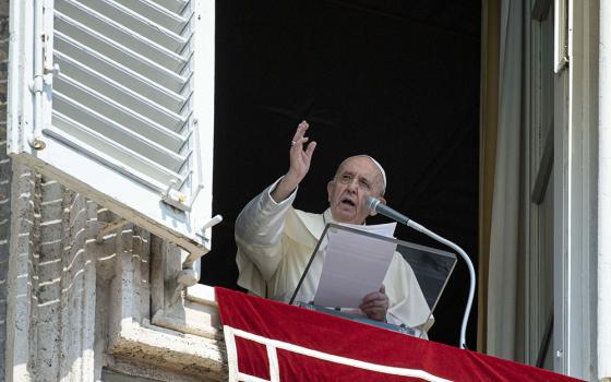 Pope Francis leads the Angelus from the window of his studio overlooking St. Peter's Square at the Vatican Aug. 22. (CNS/Vatican Media)