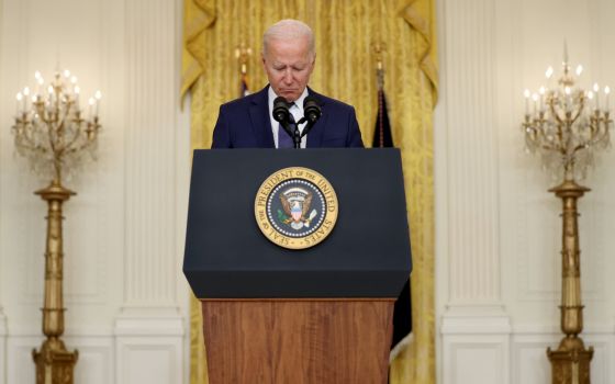 President Joe Biden reacts Aug. 26 during a moment of silence for those who died in twin explosions at the airport in Kabul, Afghanistan, as he delivers remarks about the ongoing chaos in that country at the White House in Washington. (CNS/Reuters/Jonatha