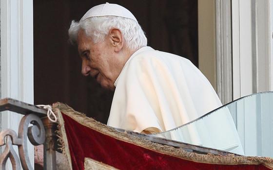 Pope Benedict XVI walks away after his final public appearance as pope in Castel Gandolfo, Italy, Feb. 28, 2013. (CNS/Paul Haring)