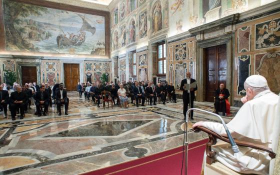 Pope Francis listens as Fr. Mathew Vattamattam, superior general of the Claretian Missionaries, speaks during an audience with members of the order at the Vatican Sept. 9. (CNS/Vatican Media)