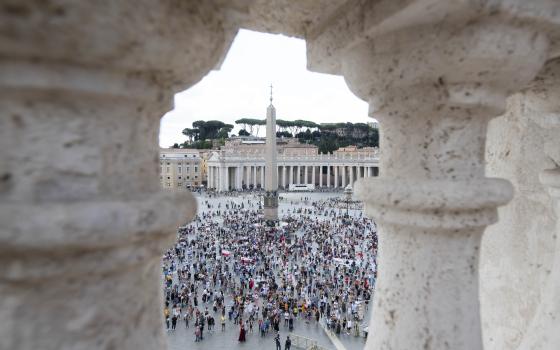 People in St. Peter's Square attend Pope Francis' recitation of the Angelus from the window of his studio overlooking the square at the Vatican Sept. 19, 2021. (CNS photo/Vatican Media)