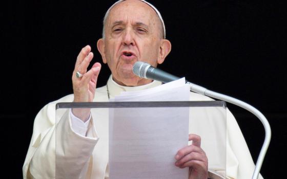 Pope Francis speaks as he leads the Angelus from the window of his studio overlooking St. Peter's Square at the Vatican Sept. 26, 2021. (CNS photo/Vatican Media)