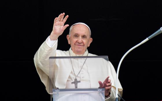 Pope Francis greets the crowd as he leads the Angelus from the window of his studio overlooking St. Peter's Square at the Vatican Sept. 26, 2021. (CNS photo/Vatican Media)