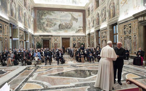 Pope Francis greets Archbishop Vincenzo Paglia during a meeting with members of the Pontifical Academy for Life in the Clementine Hall of the Apostolic Palace at the Vatican Sept. 27. (CNS/Vatican Media)