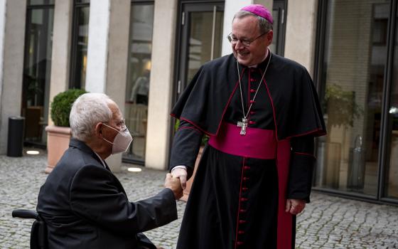 Bishop Georg Bätzing, president of the German bishops' conference, welcomes Wolfgang Schäuble, president of the Bundestag, the German federal parliament, at the annual St. Michael's reception in Berlin Sept. 27, 2021. In an address at the conference, Bish