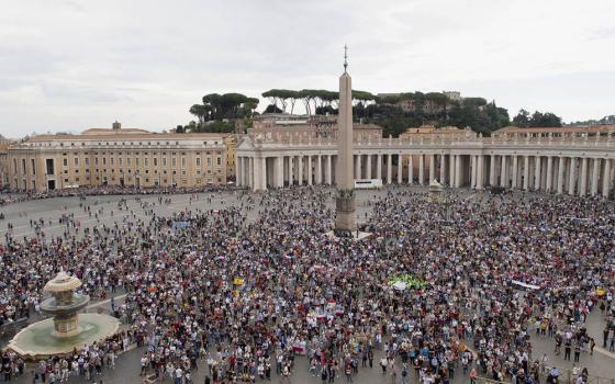 People attend the Angelus led by Pope Francis from the window of his studio overlooking St. Peter's Square at the Vatican Oct. 4. (CNS/Vatican Media)