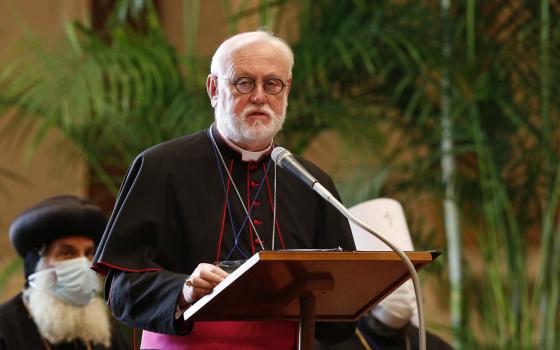 Archbishop Paul Gallagher, Vatican secretary for relations with states, speaks at the meeting, "Faith and Science: Towards COP26," with Pope Francis and other religious leaders in the Hall of Benedictions at the Vatican Oct. 4, 2021. The following day, Ar