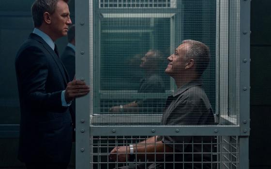 Daniel Craig and Christoph Waltz star in a scene from the movie "No Time to Die." (CNS/MGM/Nicola Dove)