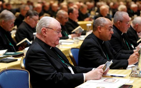 Several bishops pray during a Nov. 12, 2018, session of the U.S. Conference of Catholic Bishops' fall general assembly in Baltimore. The bishops' 2021 plenary meeting will be the first time they have met in person since the pandemic began. (CNS)