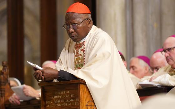 Cardinal Philippe Ouédraogo of Ouagadougou, Burkina Faso, kneels in the sanctuary at St. Patrick's Cathedral in New York City Dec. 10, 2019. (CNS photo/Gregory A. Shemitz)