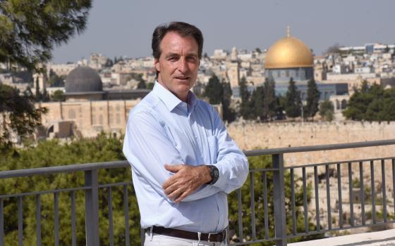 Bernard Thibaud, manager of Abraham's House, poses on the Mount of Olives overlooking Jerusalem Oct. 28, 2021. (CNS photo/Debbie Hill)