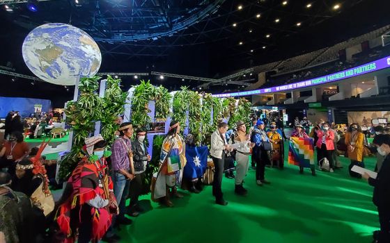 Members of the Minga Indígena, a collective of Indigenous communities throughout the American continents, address the media in the Blue Zone, the main arena for negotiations at the COP26 U.N. climate summit on Nov. 3, 2021. (NCR photo/Brian Roewe)