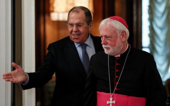 Russian Foreign Minister Sergei Lavrov enters a hall with Archbishop Paul Gallagher, Vatican secretary for relations with states, during their meeting in Moscow Nov. 9, 2021. (CNS photo/Yuri Kochetkov, pool via Reuters)