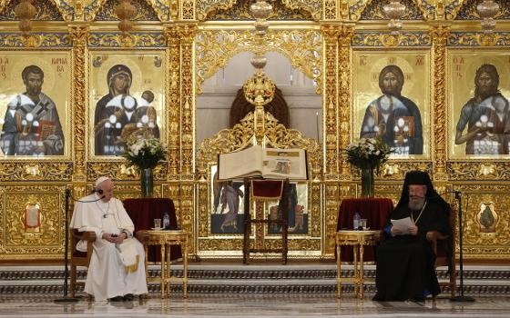 Pope Francis and Orthodox Archbishop Chrysostomos II of Cyprus attend a meeting with the Orthodox bishops who are members of the Holy Synod at the Orthodox cathedral Dec. 3 in Nicosia, Cyprus. (CNS/Paul Haring)