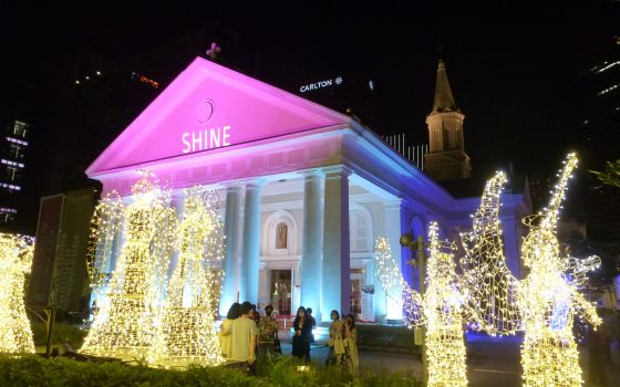 People stand outside the Cathedral of the Good Shepherd Dec. 5, 2021. (CNS photo/Christopher Khoo)