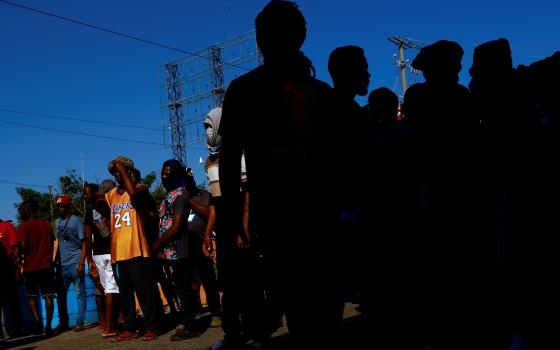 Migrants from Haiti heading to the U.S. border block a road in Huehuetán, Mexico, Nov. 30, 2021. (CNS photo/Jose Luis Gonzalez, Reuters)