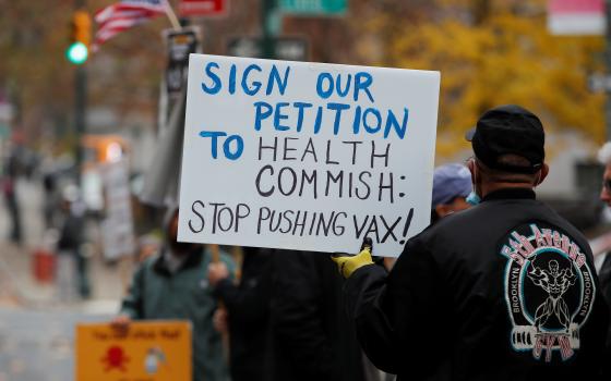 Protesters demonstrate outside the New York City Department of Health offices on Dec. 6, 2021. (CNS photo/Mike Segar, Reuters)