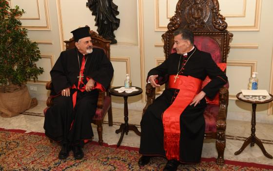 Syriac Catholic Patriarch Ignace Joseph III Younan visits Cardinal Bechara Rai, Maronite Catholic patriarch, to share Christmas greetings at Bkerke, the Maronite patriarchate near Beirut, Dec. 27, 2021. (CNS photo/Mychel Akl for Maronite patriarchate)