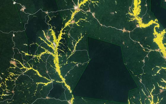 This is a map created from satellite data of the region around Obuasi, in southern Ghana. The dark green shapes show forest reserves; the yellow shows small-scale and artisanal gold mining is known locally as "galamsey." Ghana's religious leaders are calling for prayer and fasting to end the illegal mining. (CNS photo/courtesy NASA)