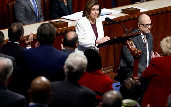 House Speaker Nancy Pelosi, D-Calif., speaks at a podium. 