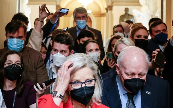 Rep. Liz Cheney, R-Wyo., and her father, former Vice President Dick Cheney, are pursued by reporters after attending a moment of silence event on Capitol Hill Jan. 6 in Washington, the first anniversary of the attack on the U.S. Capitol. (CNS)