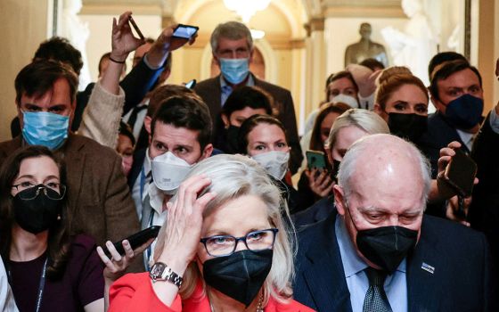 Rep. Liz Cheney, R-Wyo., and her father, former Vice President Dick Cheney, are pursued by reporters after attending a moment of silence event on Capitol Hill Jan. 6 in Washington, the first anniversary of the attack on the U.S. Capitol. (CNS)